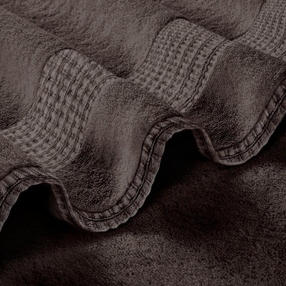 a close up of an elephant with a blanket on it
